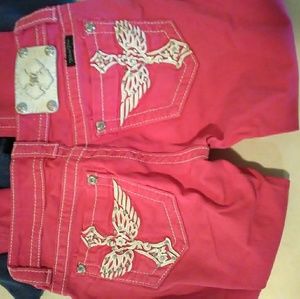 Two pairs of Miss Me jeans.